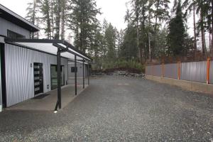 an empty parking lot next to a building at BC Cabins in Port Alberni
