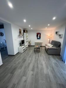 a living room with a couch and a table at Paz Jardín-Madrigueras in Madrigueras