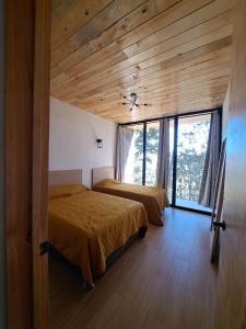 Postel nebo postele na pokoji v ubytování Cabaña La Finca Mazamitla