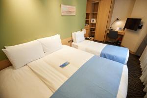 Łóżko lub łóżka w pokoju w obiekcie Days Hotel by Wyndham Seoul Myeongdong