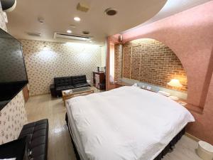 Gulta vai gultas numurā naktsmītnē HOTEL MINT HOUSE -resort and relaxation-