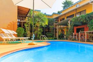 Bazén v ubytování Hotel Boutique La Casa de las Flores nebo v jeho okolí