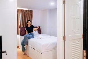 Postel nebo postele na pokoji v ubytování PT Grand Hotel