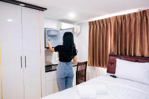 Postel nebo postele na pokoji v ubytování PT Grand Hotel