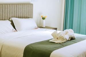 Postel nebo postele na pokoji v ubytování Bohol Cattleya Resort