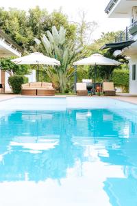 Bazén v ubytování Bohol Cattleya Resort nebo v jeho okolí