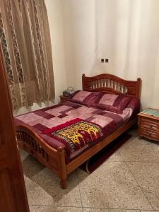 Postel nebo postele na pokoji v ubytování Duplex appartement Beni Bouayach