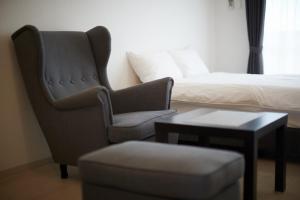 Posezení v ubytování New Normal Hotel in NAGO ニューノーマルホテルイン名護