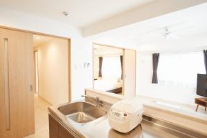 Posezení v ubytování New Normal Hotel in NAGO ニューノーマルホテルイン名護