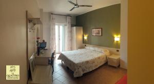 Ένα ή περισσότερα κρεβάτια σε δωμάτιο στο B&B Le Quattro Fontane