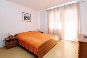Ένα ή περισσότερα κρεβάτια σε δωμάτιο στο Apartments Slava Petricevic