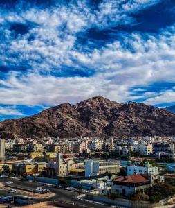 a view of a city with a mountain in the background at Galaxy Apartments in Aqaba