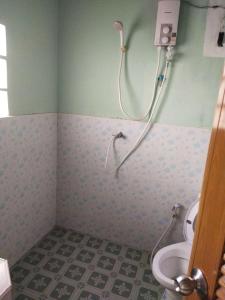 a bathroom with a shower and a toilet at Family Tanotebay Resort in Koh Tao