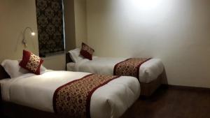 Letto o letti in una camera di Hotel Heranya