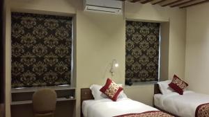 Letto o letti in una camera di Hotel Heranya