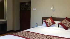 Letto o letti in una camera di Hotel Heranya