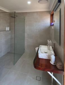 a bathroom with a sink and a shower at Arkaroola Wilderness Sanctuary in Arkaroola