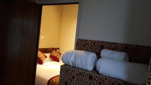 Letto o letti in una camera di Hotel Heranya