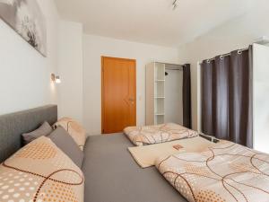 a bedroom with two beds and a closet at Mountain Idyll by the River High-End Apartment in the Ötztal Valley 