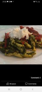 a plate of food with asparagus and rice on it at La Vecchia Fattoria in Pignola
