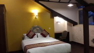 Letto o letti in una camera di Hotel Heranya