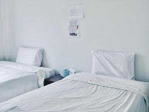 A bed or beds in a room at C-Code Resort
