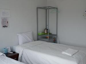A bed or beds in a room at C-Code Resort