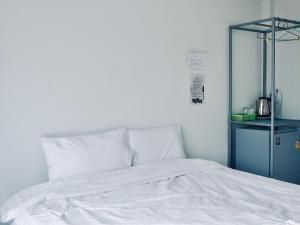 A bed or beds in a room at C-Code Resort