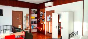 a living room with a table and a book shelf at B&B L'Assiolo in Ancona