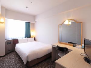 Postel nebo postele na pokoji v ubytování Chisun Hotel Yokohama Isezakicho