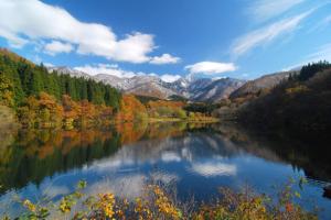 a view of a lake with trees and mountains at Angel Resort Yuzawa / Vacation STAY 2641 in Yuzawa