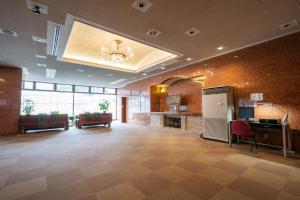 a large lobby with a desk and a fireplace at Angel Resort Yuzawa / Vacation STAY 2641 in Yuzawa