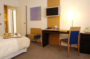 Télévision ou salle de divertissement dans l'établissement Novotel Andorra