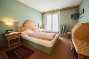 Ένα ή περισσότερα κρεβάτια σε δωμάτιο στο HOTEL GARNi NORMA