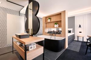 a bathroom with a sink and a mirror at Gr8 Hotel Breda in Breda