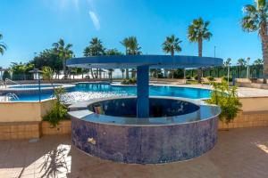 Bazén v ubytování CB Living - Beachfront apartment in Aguamarina nebo v jeho okolí