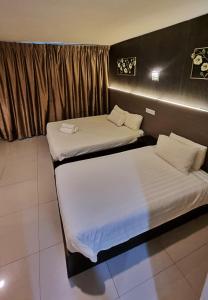 Letto o letti in una camera di One Point Hotel