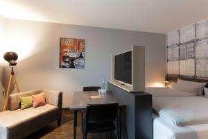 Zona de estar de Vienna House Easy by Wyndham Bremen City Apartments