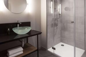 Un baño de Vienna House Easy by Wyndham Bremen City Apartments