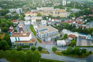 an aerial view of a small town with buildings at Vienna House Easy by Wyndham Coburg in Coburg