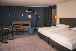 Postel nebo postele na pokoji v ubytování Vienna House Easy by Wyndham Trier