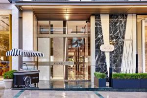 a store front of a building with an umbrella at Vakko Hotel and Residence in Istanbul