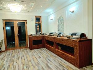 a lobby with a reception desk in a building at Latifa Begim Boutique Hotel in Bukhara