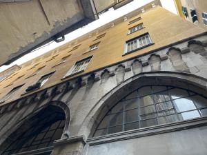 a building with windows on the side of it at La dimora dei Rolli in Genoa
