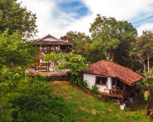 a house in the middle of a forest at Maluk House (1 bedroom) in Maluk