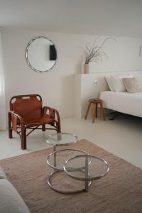 a living room with a coffee table and a couch at Parisina Design Rooms in Pescara