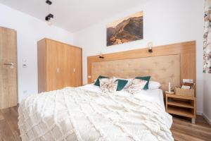 Posteľ alebo postele v izbe v ubytovaní Apartamenty Jasiowe Turnie nr 3 i nr 10 Krupówki 3km