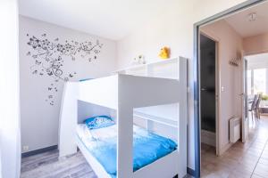 Posteľ alebo postele v izbe v ubytovaní Les Etrilles