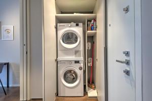 a washing machine and a washer in a closet at V. Veneto Suite - Porta Venezia - Milano Centro in Milan