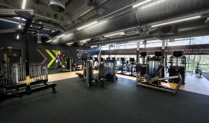 a gym with several treadmills and machines in it at Bisham Abbey National Sports Centre in Marlow